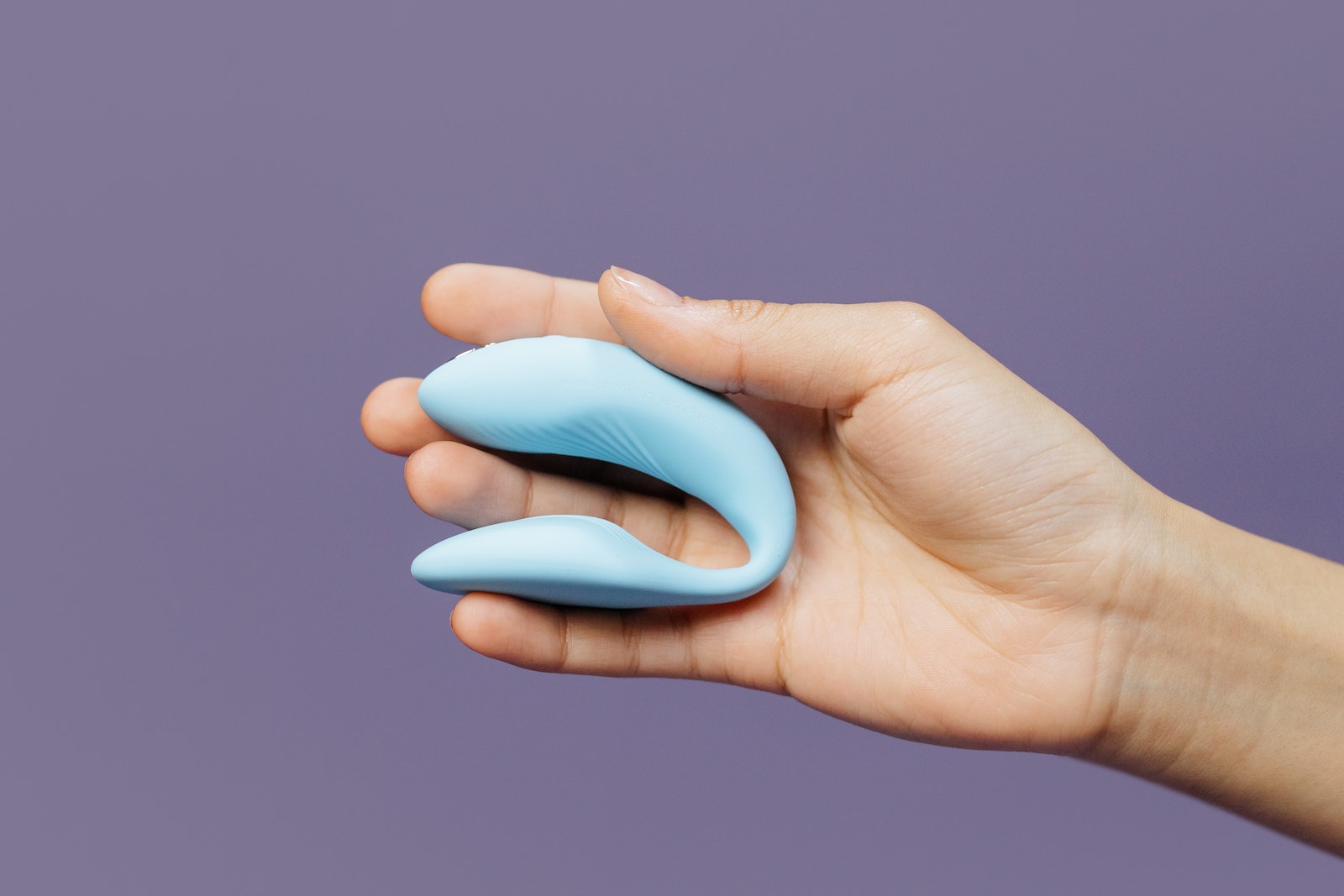 Close-Up Shot of a Person Holding an Adult Toy