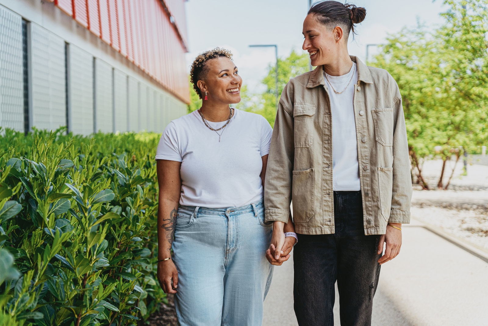 Portrait of nonbinary autistic person with their wife outdoors